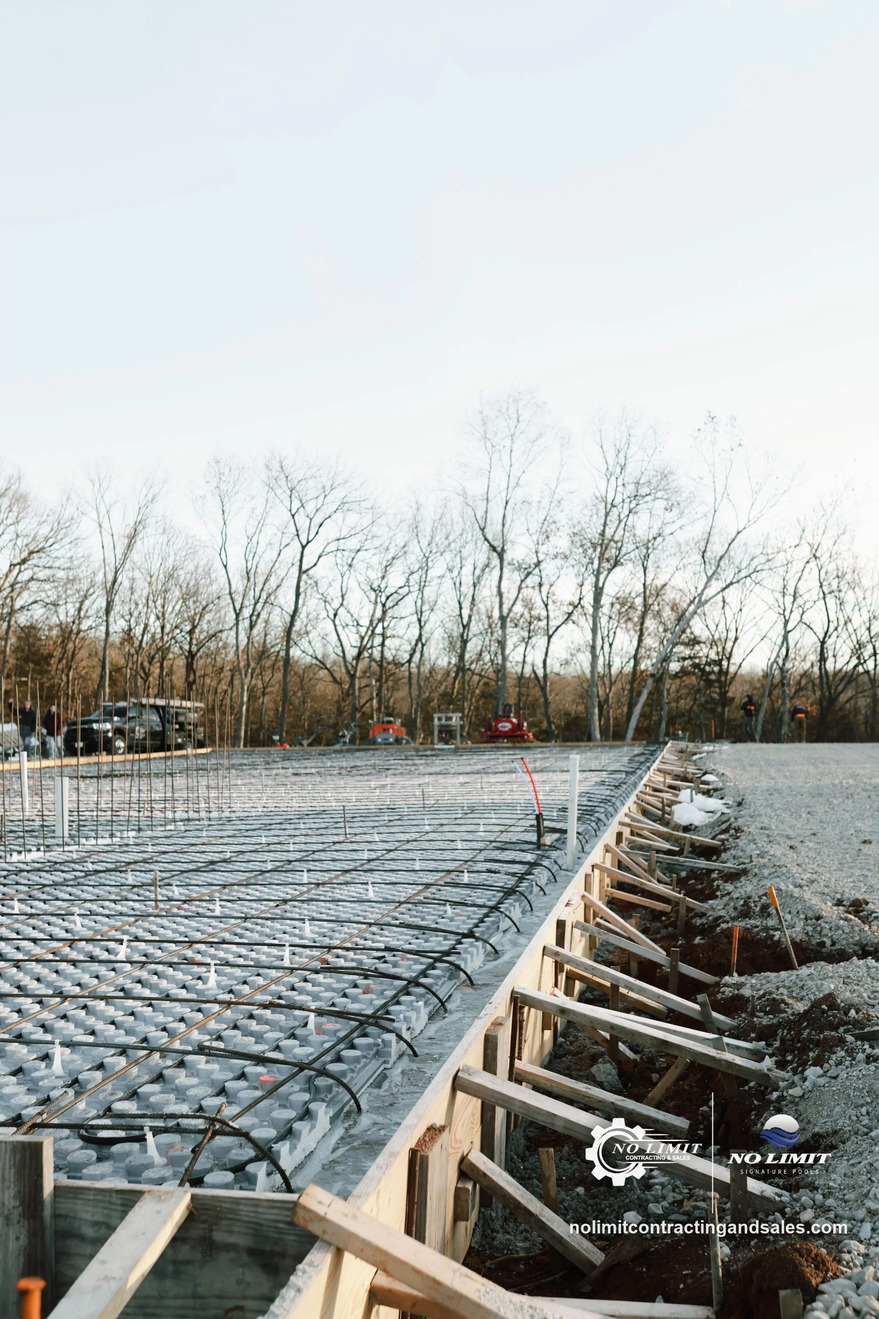 Slab formwork with insulated panels and rebar grid before pour by No Limit Contracting & Sales